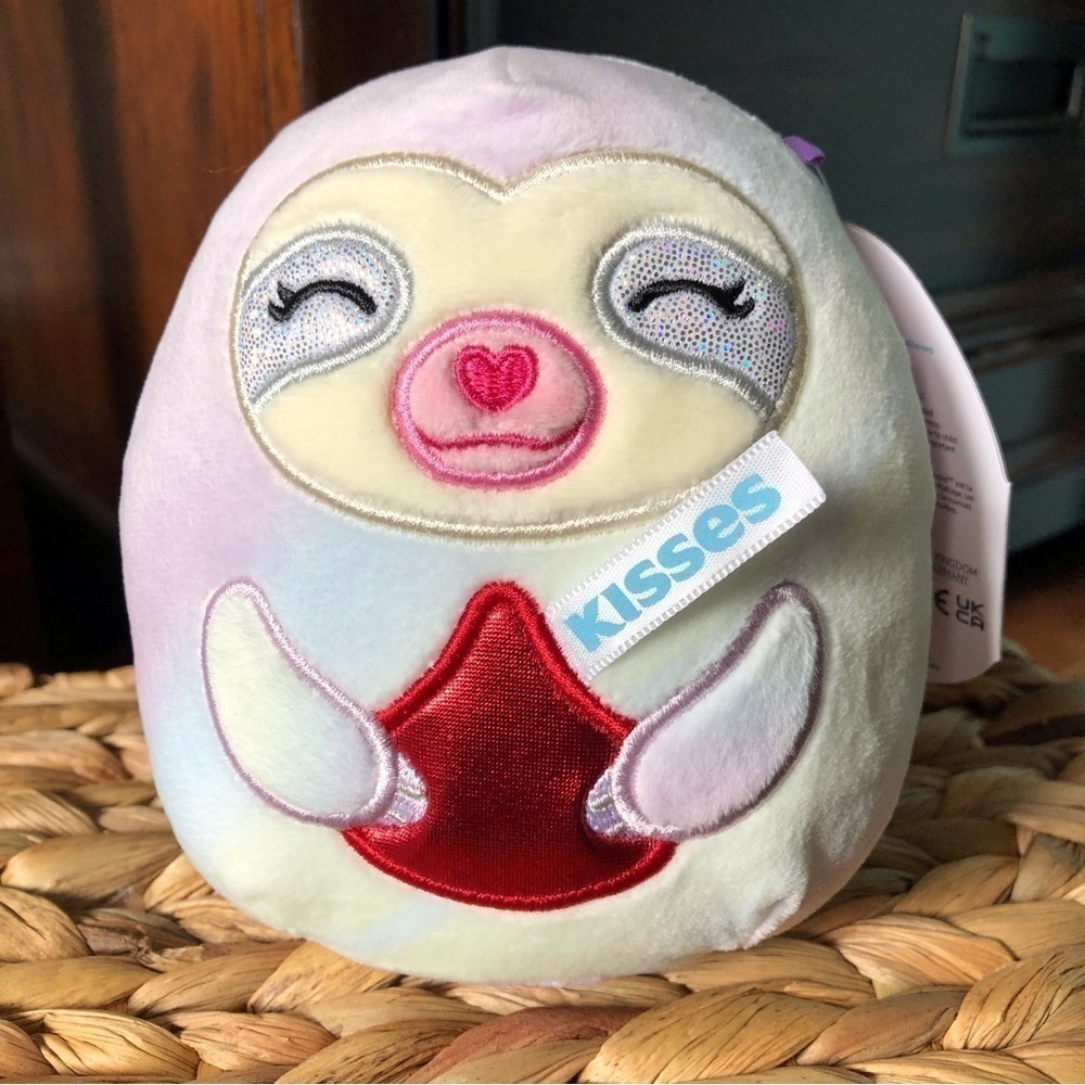 Squishmallows Taylor the Sloth with arms holding a Heresy kisses 5”